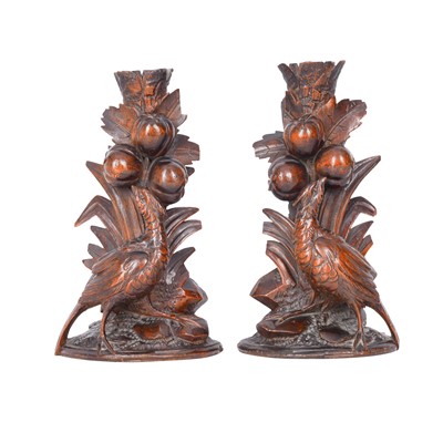 Lot 142 - A pair of Black Forest carved candle holders