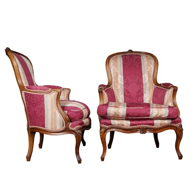 Lot 202 - A pair of Louis XV style walnut bergères