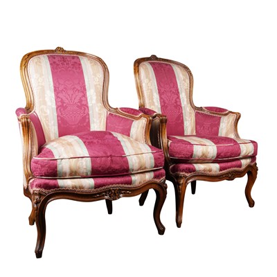 Lot 202 - A pair of Louis XV style walnut bergères