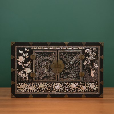 Lot 255 - A fine Korean mother-of-pearl inlaid lacquered wood chest, Joseon dynasty, 19th century