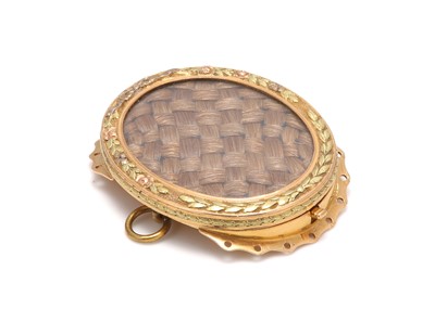 Lot 247 - A Louis XVI French vari-coloured gold and...