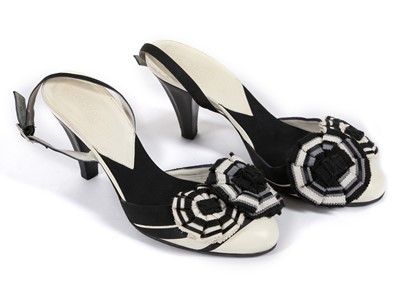 Lot 475 - Chanel black and white sling backs, 3cm kitten...