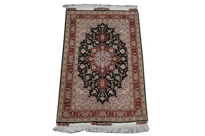 Lot 62 - A FINE WOOL & SILK SIGNED TABRIZ RUG, NORTH...