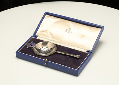 Lot 100 - A cased Edward VIII silver tea strainer,...