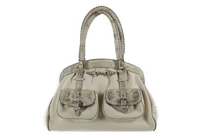 Lot 570 - Christian Dior Sac a main Python, cream canvas...