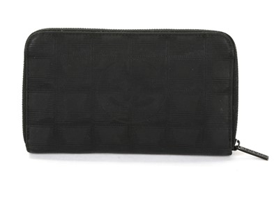 Lot 496 - Chanel black New Travel Line wallet, c....