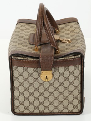 Lot 314 - Three monogram Gucci travel bags, 1990s, brown...