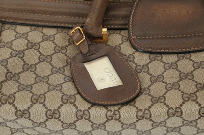 Lot 314 - Three monogram Gucci travel bags, 1990s, brown...
