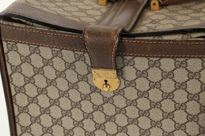 Lot 314 - Three monogram Gucci travel bags, 1990s, brown...