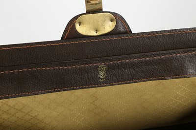 Lot 314 - Three monogram Gucci travel bags, 1990s, brown...