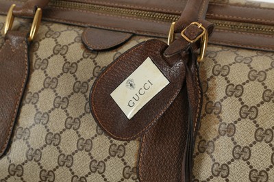 Lot 314 - Three monogram Gucci travel bags, 1990s, brown...