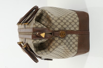Lot 314 - Three monogram Gucci travel bags, 1990s, brown...