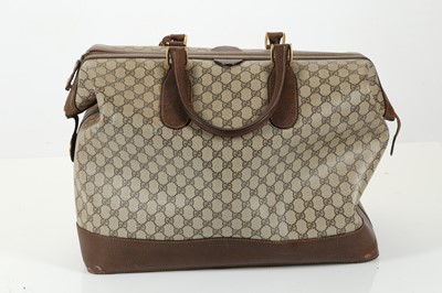 Lot 314 - Three monogram Gucci travel bags, 1990s, brown...