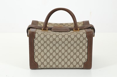 Lot 314 - Three monogram Gucci travel bags, 1990s, brown...