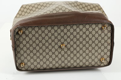 Lot 314 - Three monogram Gucci travel bags, 1990s, brown...