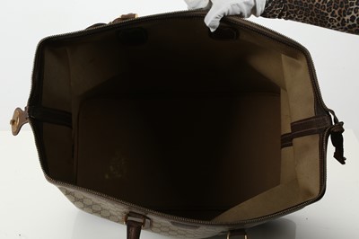 Lot 314 - Three monogram Gucci travel bags, 1990s, brown...