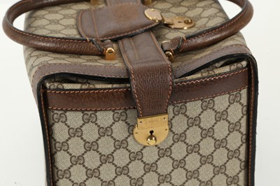 Lot 314 - Three monogram Gucci travel bags, 1990s, brown...