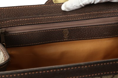 Lot 314 - Three monogram Gucci travel bags, 1990s, brown...