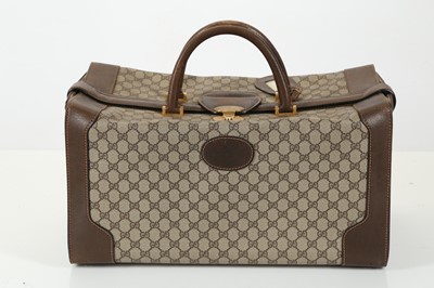 Lot 314 - Three monogram Gucci travel bags, 1990s, brown...