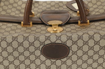 Lot 314 - Three monogram Gucci travel bags, 1990s, brown...