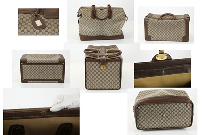 Lot 314 - Three monogram Gucci travel bags, 1990s, brown...