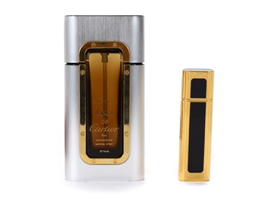 Lot 624 - Two vintage Cartier vaporisers, the first gilt...