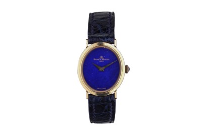 Lot 30 - BAUME & MERCIER. AN 18K YELLOW GOLD MANUAL...