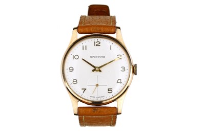 Lot 56 - GARRARD. A 9K GOLD MANUAL WIND WRISTWATCH....