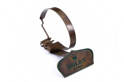 Lot 60 - ROLEX. A 1950'S BRASS WATCH DISPLAY STAND....
