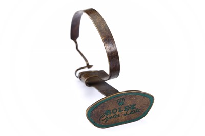 Lot 61 - ROLEX. A 1950'S BRASS WATCH DISPLAY STAND....