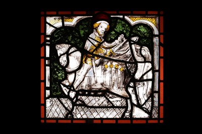 Lot 115 - A STAINED AND LEADED GLASS PANEL DEPICTING ST...