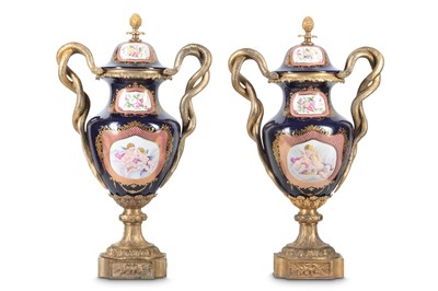 Lot 137 - A PAIR OF LOUIS XV STYLE PORCELAIN AND GILT...