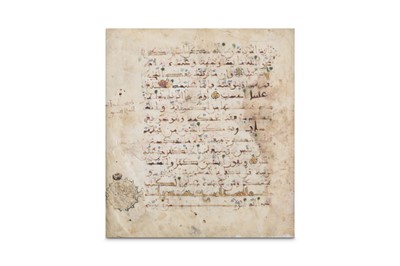 Lot 26 - A LOOSE FOLIO FROM A MAGHRIBI QUR'AN North...