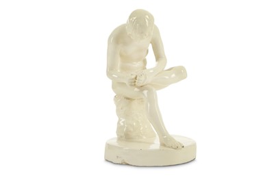 Lot 113 - A WHITE GLAZED EARTHENWARE FIGURE OF THE...
