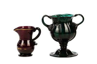 Lot 208 - AN UNUSUAL EMERALD-GREEN MOULDED GLASS LOVING...