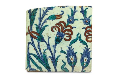 Lot 84 - AN IZNIK POTTERY TILE  Ottoman Turkey, late...