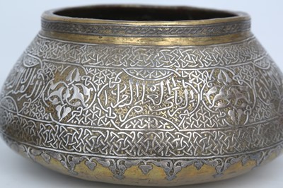 Lot 113 - A MAMLUK-REVIVAL BRASS BOWL AND CANDLESTICK...