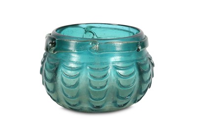 Lot 1 - AN EARLY ABBASID DEEP GREEN HOT-WORKED GLASS...