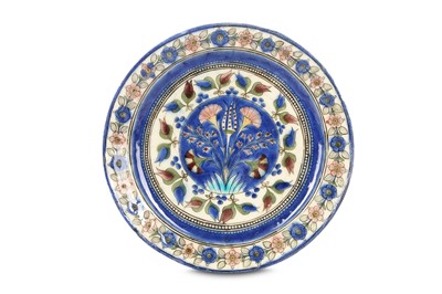 Lot 161 - A LATE QAJAR POTTERY DISH Iran, late 19th -...
