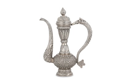 Lot 282 - A SILVER REPOUSSÉ LIDDED EWER Possibly Ladakh...