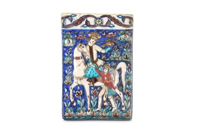 Lot 147 - * A QAJAR MOULDED POTTERY TILE WITH FALCONER...