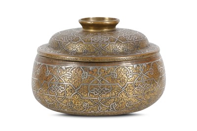 Lot 19 - A VENETO-SARACENIC SILVER-INLAID BRASS LIDDED...
