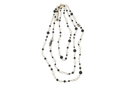 Lot 66 - Chanel Monochrome Coco Sautoir, c. 2011, three...