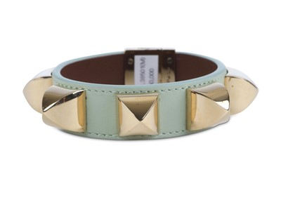 Lot 5 - Givenchy Pale Green Studded Bangle, leather...