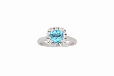 Lot 767 - A blue topaz and diamond cluster ring, set...