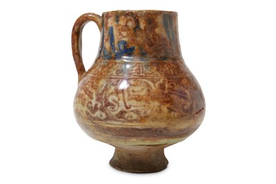 Lot 112 - A RAQQA COPPER-LUSTRE POTTERY JUG Syria, 13th...