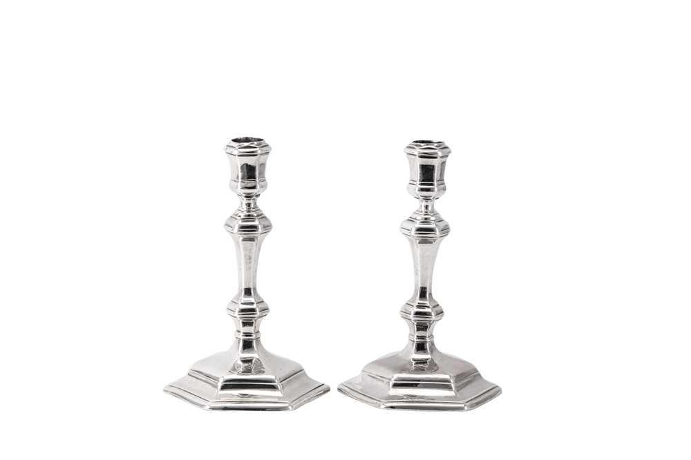 Lot 3 - A matched pair of George I / George II Britannia standard and sterling silver candlesticks, London 1715 by Richard Greene (reg. 15th April 1703) and London 1731 by James Gould (reg. 19th Nov 1722)