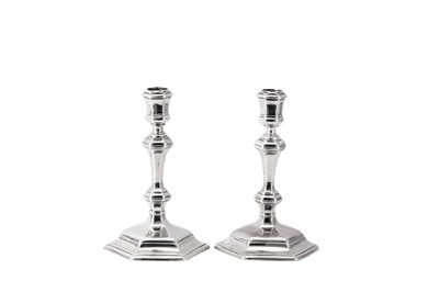 Lot 3 - A matched pair of George I / George II Britannia standard and sterling silver candlesticks, London 1715 by Richard Greene (reg. 15th April 1703) and London 1731 by James Gould (reg. 19th Nov 1722)