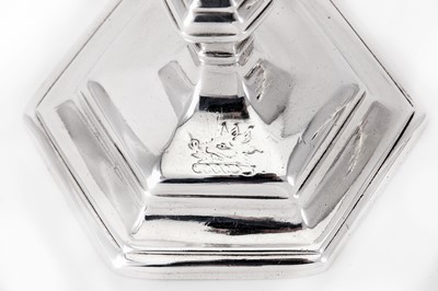 Lot 3 - A matched pair of George I / George II Britannia standard and sterling silver candlesticks, London 1715 by Richard Greene (reg. 15th April 1703) and London 1731 by James Gould (reg. 19th Nov 1722)