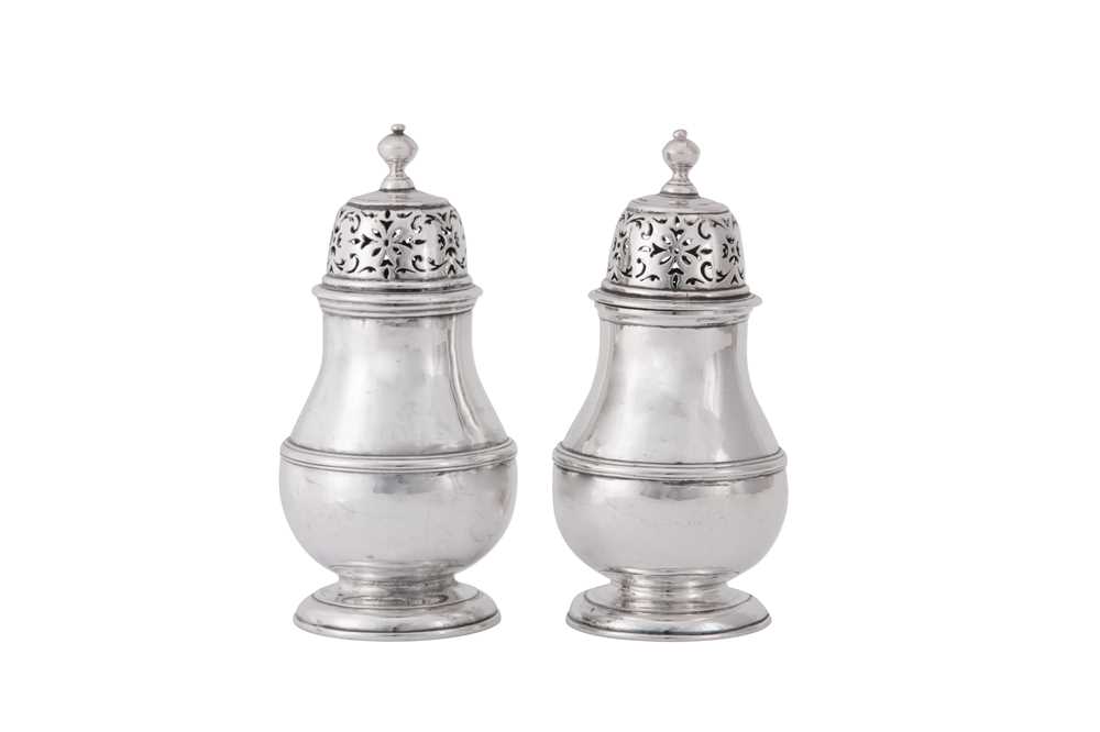 Lot 2 - A pair of George I Britannia standard silver pepper casters, London 1714 by Samuel Welder (first reg. 4th Aug 1714)